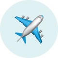 Blue and white airplane icon on a light blue circular background